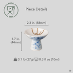 Kintsugi Arita sake cup with diameter, height, and weight measurements overlaid on the front view, gold seams visible across blue splatter glaze.