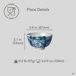 Ko-Imari sake cup in blue and white sometsuke porcelain with 24K gold kintsugi seams, restored with natural urushi, shown beside an object for scale reference.