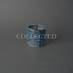 Ko-Imari sake cup in sometsuke blue takokarakusa porcelain with 24K gold kintsugi lines and cloud motifs in raised lacquer at the rim, restored with natural urushi. Collected.