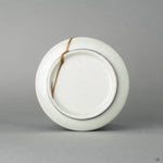 The base of this Ko-Imari piece, where the kintsugi restoration meets the original porcelain, emphasizing its heritage luxury.