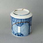Detailed view of the porcelain pattern where the gold kintsugi flows, a tangible piece of Japanese philosophy made visible.
