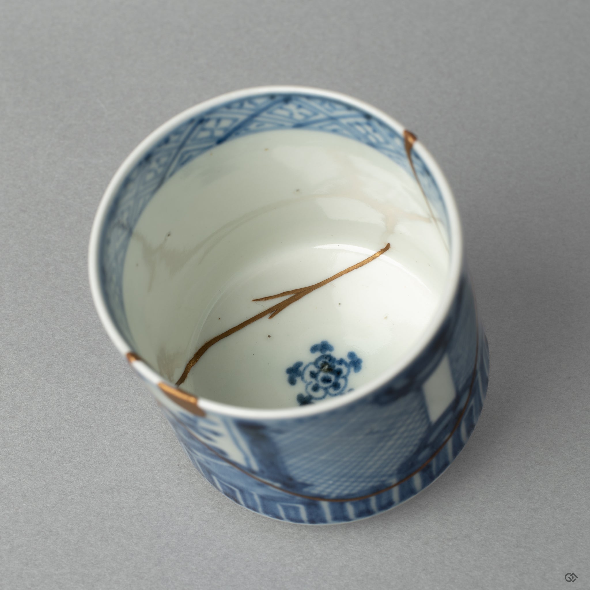 A glance into the cup's interior, showing the smooth, food-safe urushi lacquer beneath the kintsugi; restorative beauty for daily use.