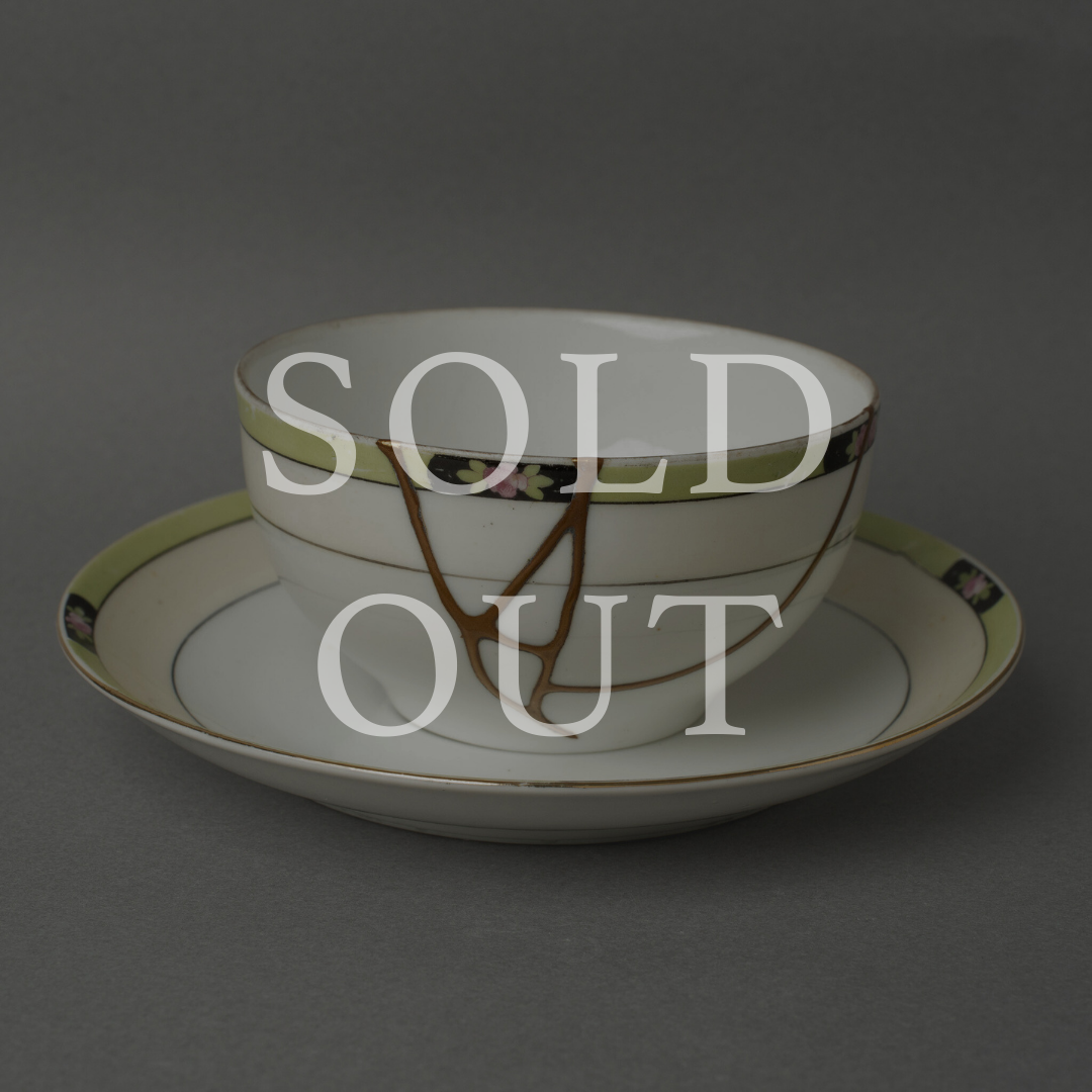 Sold out — An Art Deco Early Noritake cup and saucer with hand-painted florals, restored with authentic 24K gold kintsugi and natural urushi lacquer. This one-of-a-kind piece by The Kintsugi Labo JAPAN has found its home.