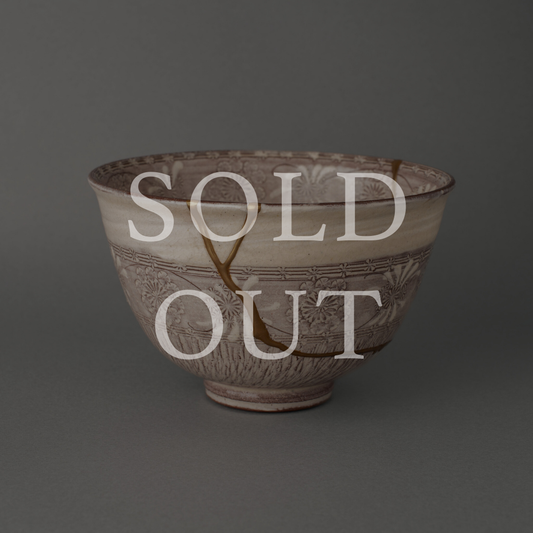 Sold out — A purple Kyoto ware matcha bowl with Mishima pressed patterns, restored with authentic 24K gold kintsugi and natural urushi lacquer. This one-of-a-kind piece by The Kintsugi Labo JAPAN has found its home.
