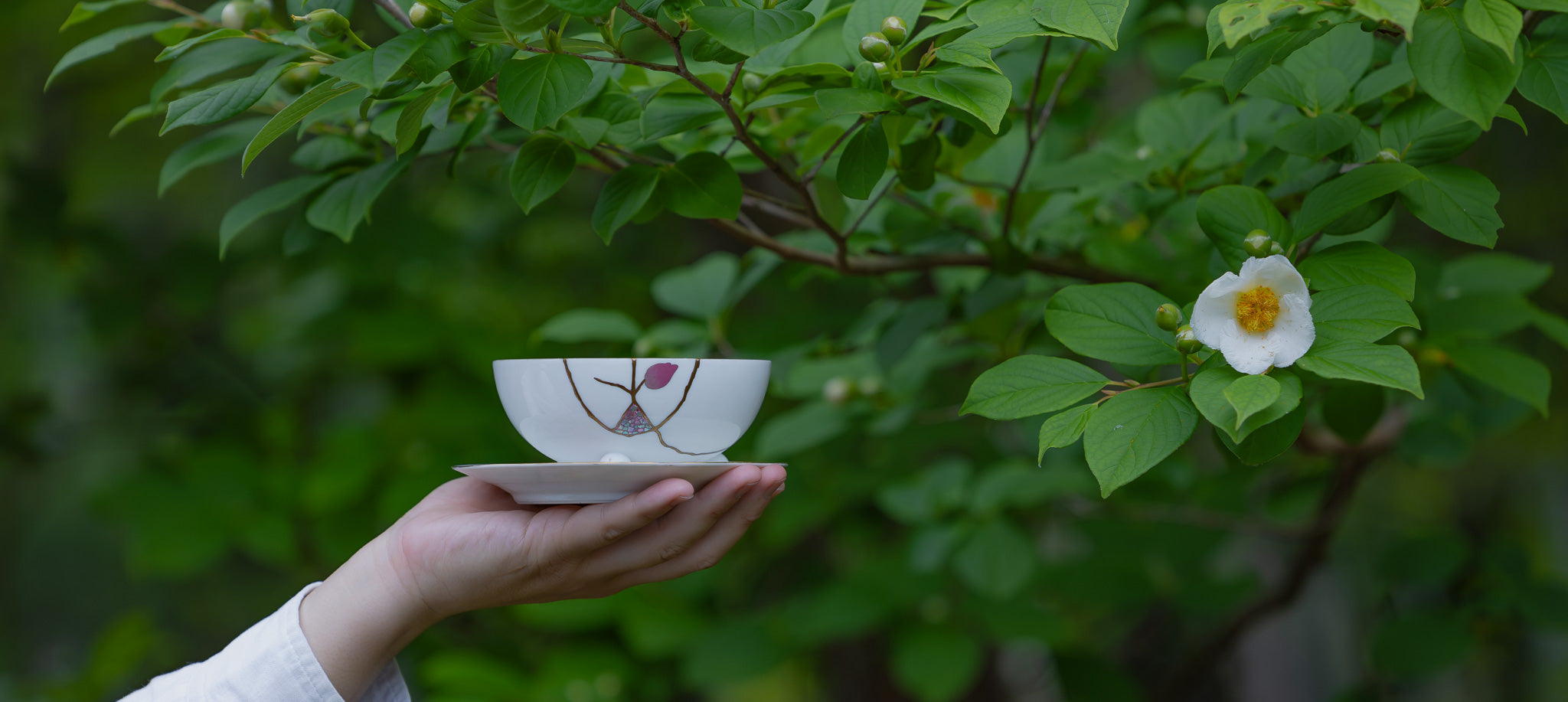 Authentic kintsugi piece restored with natural urushi lacquer, showcasing the sustainable art of Japanese pottery repair.