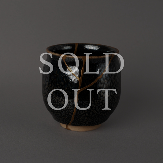 Authentic Japanese Kintsugi Kyo-yaki tea cup, hand restored with urushi and 24K gold, marked sold out.