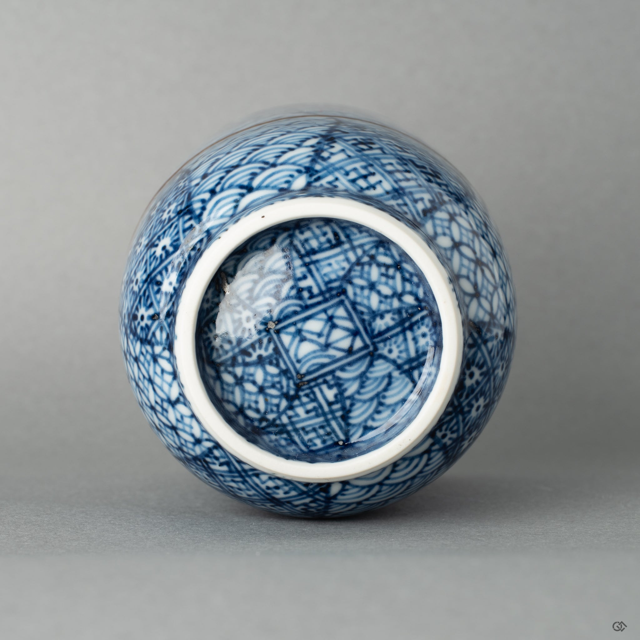 Bottom view showing the base of a Kyoto tea cup with kintsugi restoration, a collector's treasure grounded in tradition.