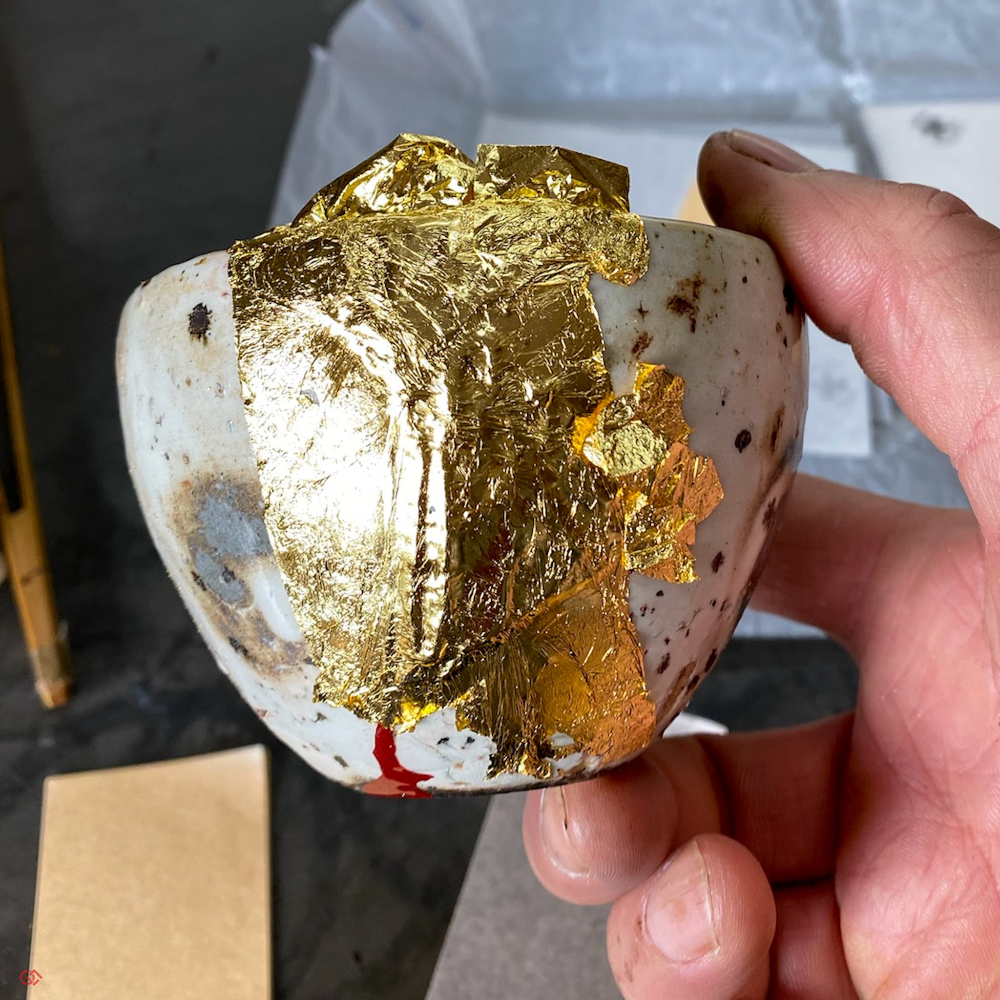 Traditional Kintsugi repair with gold leaf