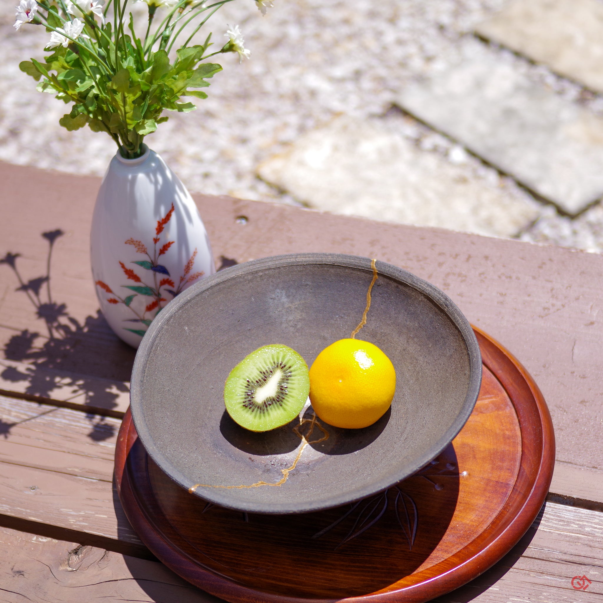 Japanese Kintsugi Pottery with some fruits